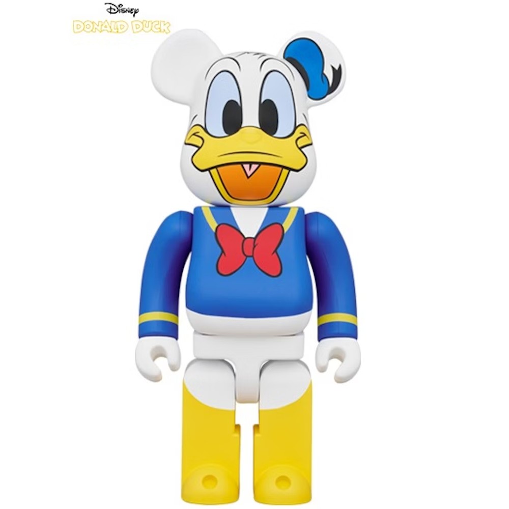 400% Bearbrick Donald Duck featuring classic sailor outfit, red bow tie, and cheerful face with wide beak smile.