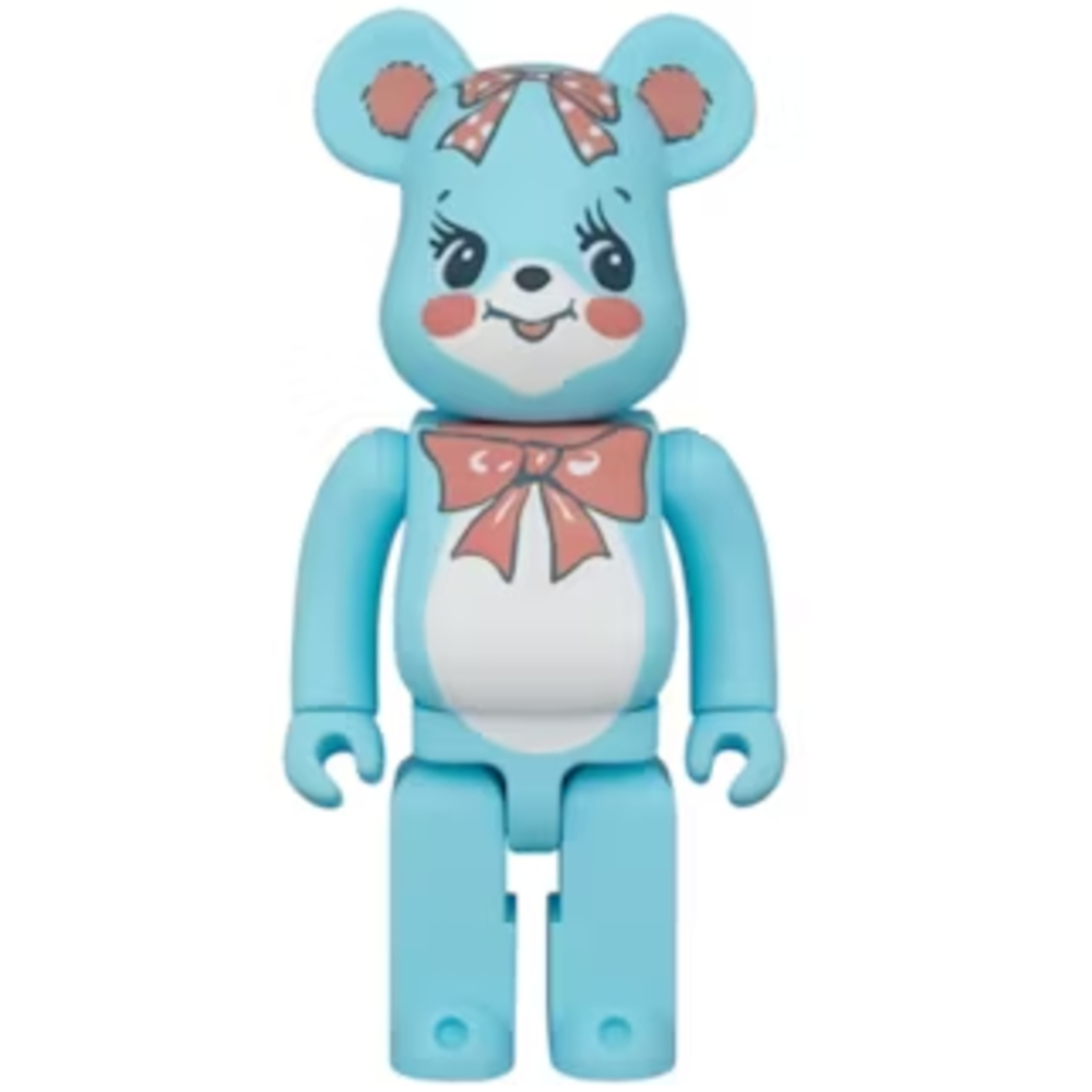 400% Bearbrick Swimmer Huggly in pastel blue with cartoon-style face, red cheeks, and bow design on chest