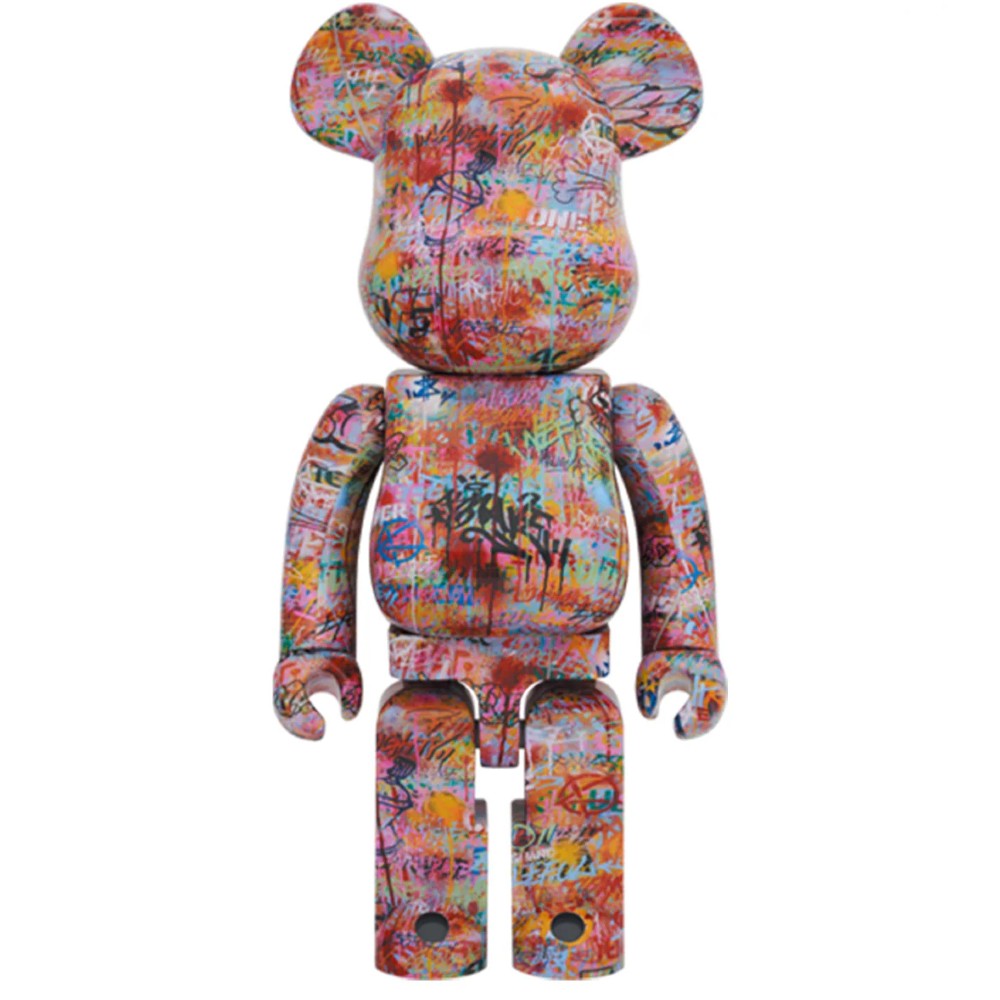 1000% Bearbrick Knave by P(L:R)AYER featuring vivid graffiti-style multicolor tags and street art-inspired patterns.