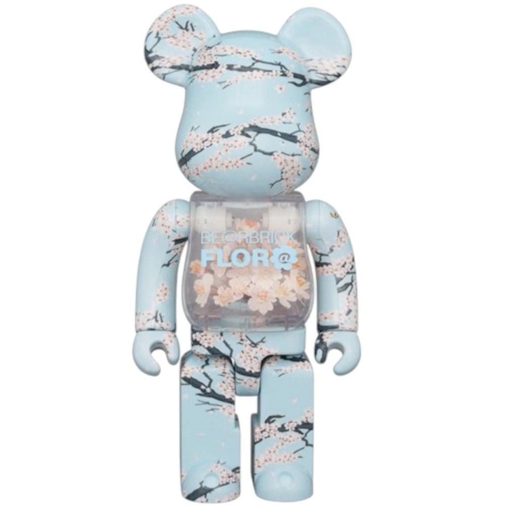 400% Bearbrick Flora Sakura – collectible designer toy featuring cherry blossom floral pattern with transparent torso and pastel blue finish