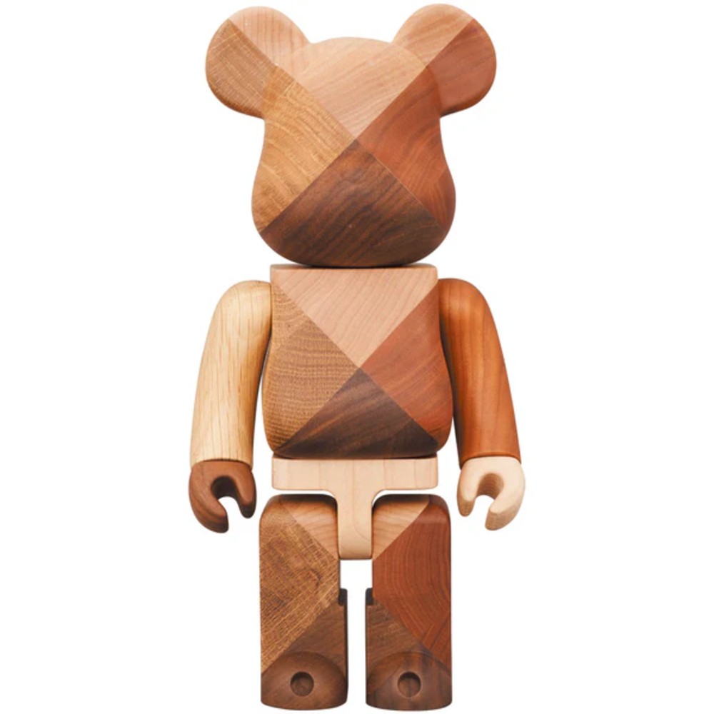 400% Bearbrick Karimoku 1:4 crafted from four types of natural wood in a geometric patchwork pattern with rich grain tones.