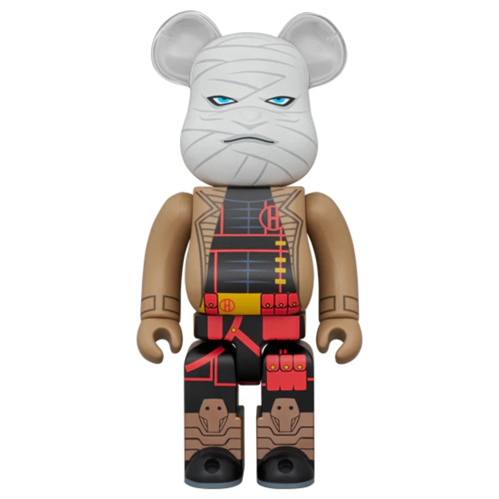 Bearbrick figure with wrapped face design and brown outfit, front view.