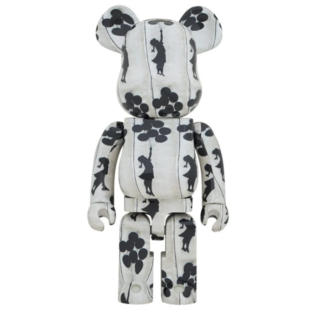 White bearbrick with a print of girl on flying balloons.